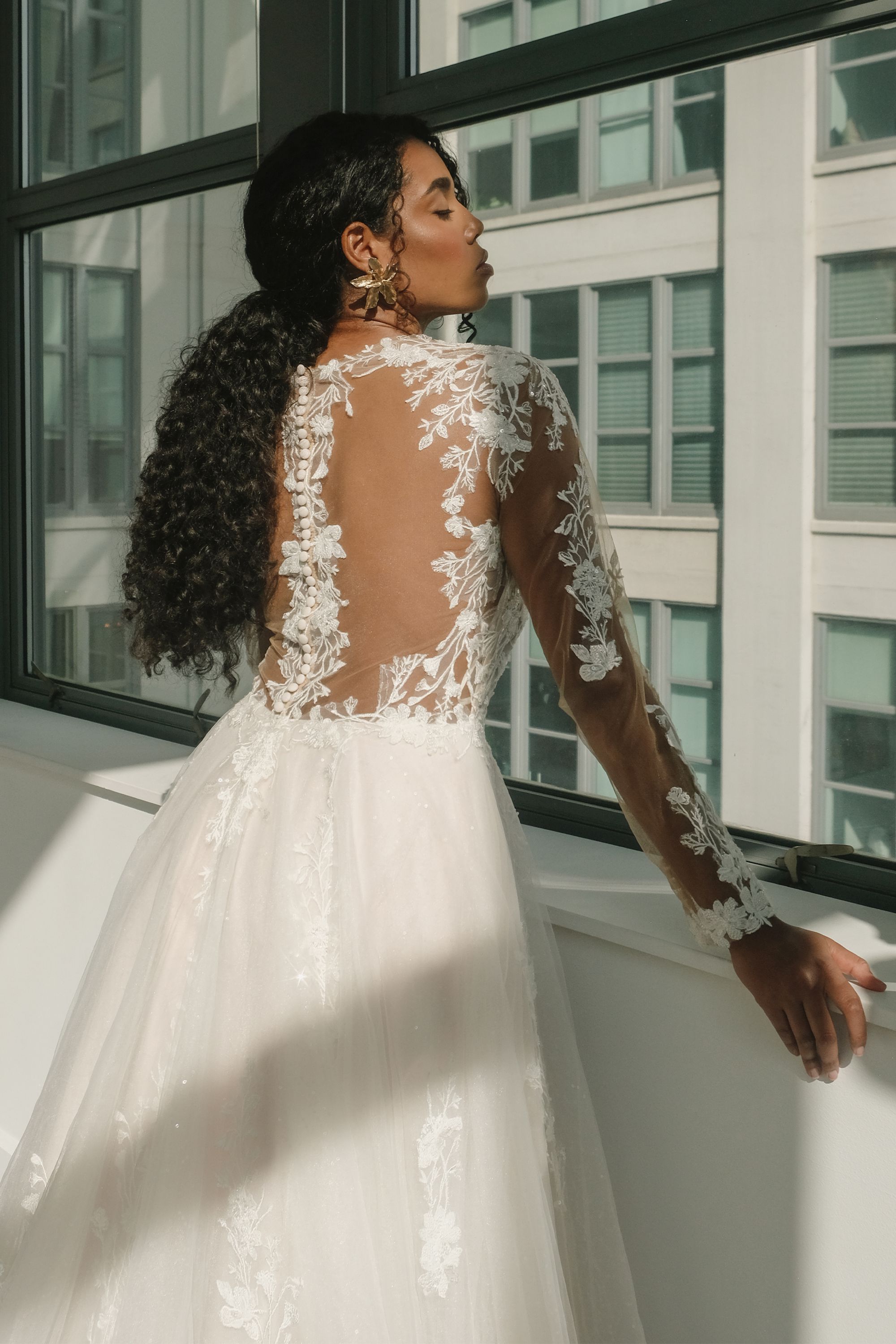 Style Delilah: Sequin Tulle Ball Gown with Long Sleeves and Illusion